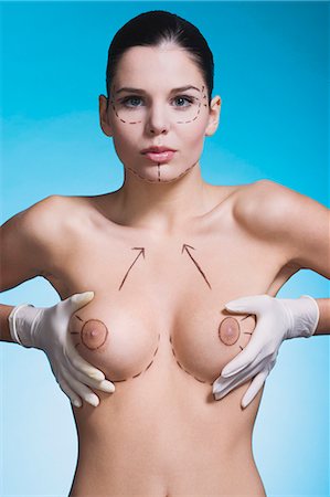 simsearch:700-00917680,k - Young woman with presurgical markings on breast and face Stock Photo - Rights-Managed, Code: 877-06836305