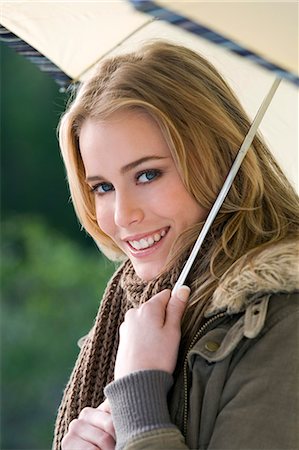 simsearch:877-06836114,k - Portrait of a young woman with umbrella Stock Photo - Rights-Managed, Code: 877-06836317