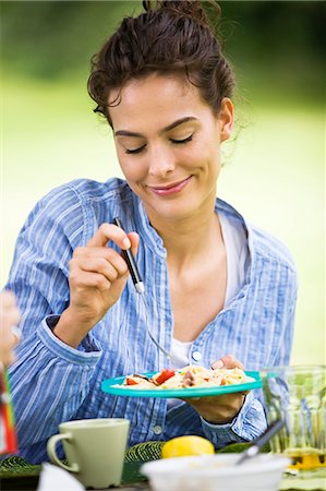 summer eating and clothes - Young woman eating salad Stock Photo - Rights-Managed, Code: 877-06832208