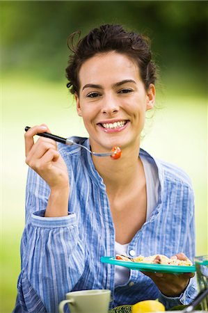 summer eating and clothes - Young woman eating salad Stock Photo - Rights-Managed, Code: 877-06832209