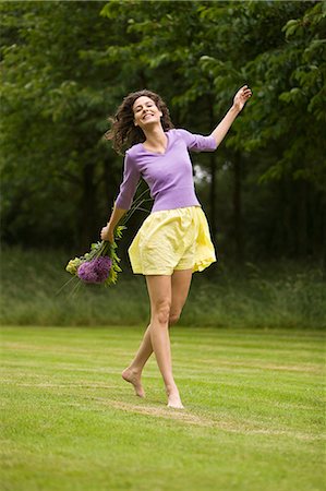 Young woman holding a bouquet of flowers Stock Photo - Rights-Managed, Code: 877-06832254