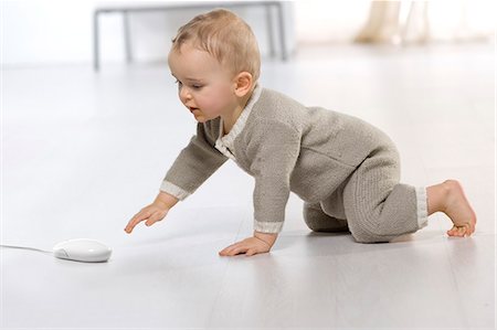 Baby on floor, computer mouse Stock Photo - Rights-Managed, Code: 877-06832384