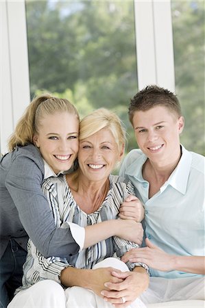 simsearch:877-06835784,k - Young couple embracing mature woman Stock Photo - Rights-Managed, Code: 877-06832448