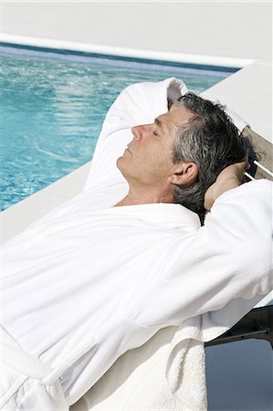 simsearch:877-06832482,k - Senior man lying near a pool Foto de stock - Con derechos protegidos, Código: 877-06832474