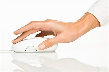 Woman's hand holding a  computer mouse Stock Photo - Rights-Managed, Code: 877-06832569