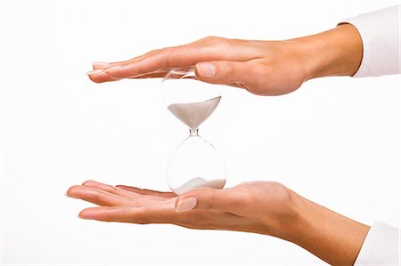 Woman's hands holding a hourglass Photographie de stock - Rights-Managed, Code: 877-06832589