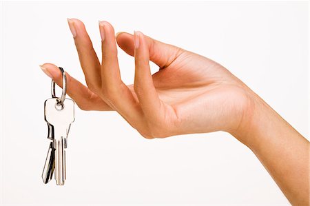 Woman's hand holding keys Photographie de stock - Rights-Managed, Code: 877-06832608