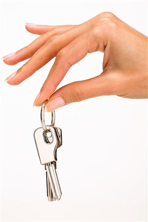 finger white background - Woman's hand holding keys Stock Photo - Rights-Managed, Code: 877-06832603