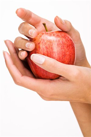 Woman's hands holding an apple Stock Photo - Rights-Managed, Code: 877-06832628