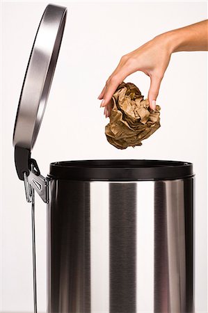 paper background - Woman's hand throwing paper in the garbage Stock Photo - Rights-Managed, Code: 877-06832620