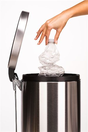 Woman's hand throwing a plastic bottle in the garbage Stock Photo - Rights-Managed, Code: 877-06832622