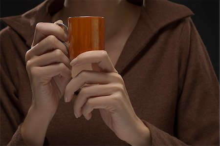 simsearch:877-06832579,k - Close-up of woman's hands holding cup of coffee Stock Photo - Rights-Managed, Code: 877-06832794