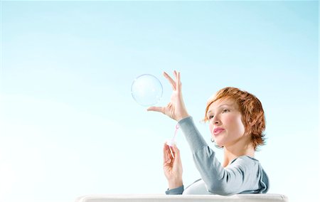 simsearch:877-06833387,k - Young woman blowing bubble Stock Photo - Rights-Managed, Code: 877-06832799