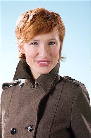 simsearch:877-06835868,k - Portrait of young smiling woman wearing coat Photographie de stock - Rights-Managed, Code: 877-06832808