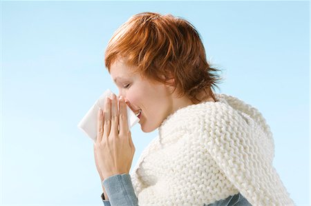 sneeze in her handkerchief - Portrait of woman sneezing Stock Photo - Rights-Managed, Code: 877-06832885