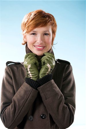 Portrait of woman on light blue background Photographie de stock - Rights-Managed, Code: 877-06832893