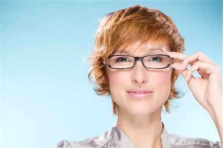 simsearch:877-06832874,k - Portrait of young woman with eyeglasses Fotografie stock - Rights-Managed, Codice: 877-06833157