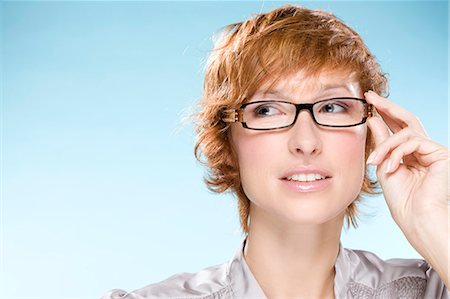 simsearch:877-06833378,k - Portrait of young woman with eyeglasses Foto de stock - Con derechos protegidos, Código: 877-06833158