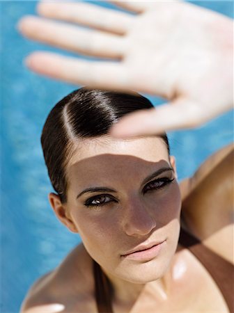 protection - Young woman at poolside Stock Photo - Rights-Managed, Code: 877-06833264