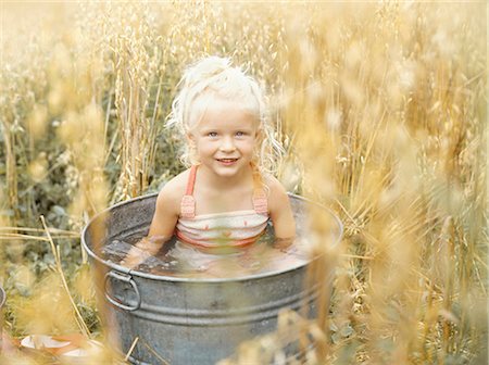 simsearch:877-06833272,k - Little girl in metal basin Stock Photo - Rights-Managed, Code: 877-06833272