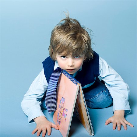 simsearch:877-06833387,k - Little boy playing with a book Stock Photo - Rights-Managed, Code: 877-06833296