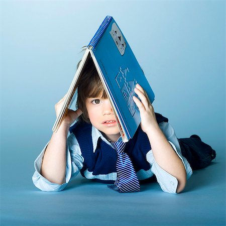 simsearch:877-06833387,k - Little boy playing with a book Stock Photo - Rights-Managed, Code: 877-06833299