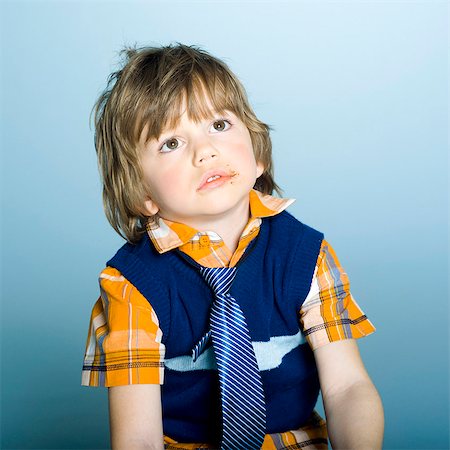 stain on shirt - Little boy thinking Stock Photo - Rights-Managed, Code: 877-06833302