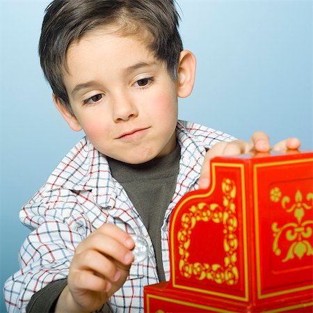 Little boy playing with toy cash register Stock Photo - Rights-Managed, Code: 877-06833351