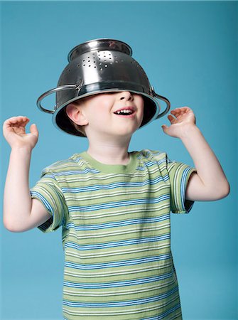 funny background - Little boy playing with a colander Stock Photo - Rights-Managed, Code: 877-06833385