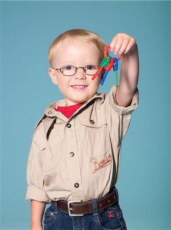 Little boy holding bunch of plastic keys Stock Photo - Rights-Managed, Code: 877-06833382