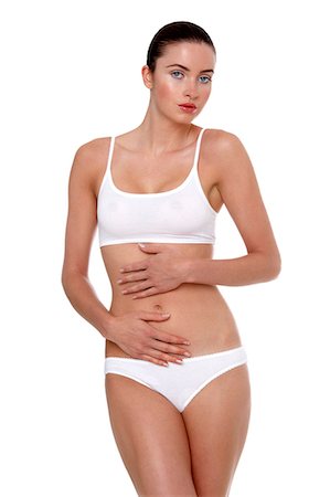 simsearch:877-06834255,k - Woman in underwear with her hands on her stomach Foto de stock - Con derechos protegidos, Código: 877-06833587