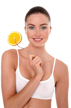 simsearch:877-06833602,k - Woman holding an orange slice Foto de stock - Con derechos protegidos, Código: 877-06833601