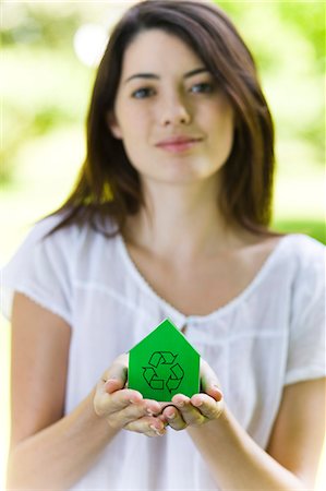 simsearch:877-07460580,k - Young woman holding green model house with recycling sign Foto de stock - Con derechos protegidos, Código: 877-06833795