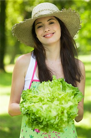 Young woman holding a lettuce Stock Photo - Rights-Managed, Code: 877-06833872