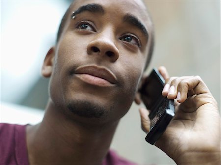 Teenage boy phoning Stock Photo - Rights-Managed, Code: 877-06833929