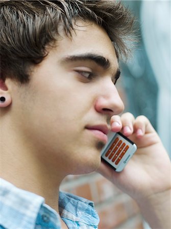 simsearch:877-06833900,k - Teenage boy phoning Stock Photo - Rights-Managed, Code: 877-06833923