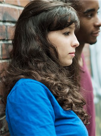 simsearch:877-06833900,k - Teenagers leaning against wall Foto de stock - Con derechos protegidos, Código: 877-06833998