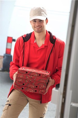 France, deliveryman at main door. Stock Photo - Rights-Managed, Code: 877-07460400