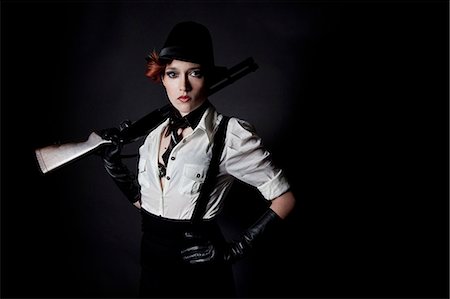 rossetto - Red hair gangster woman with gun Fotografie stock - Rights-Managed, Codice: 877-07460539