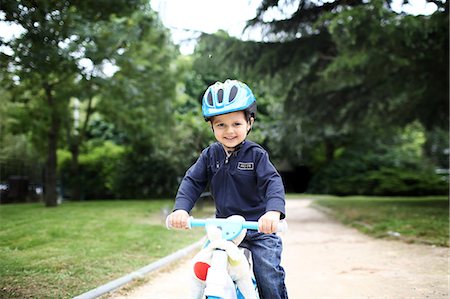 A little boy and his bike at the park Photographie de stock - Rights-Managed, Code: 877-07460612