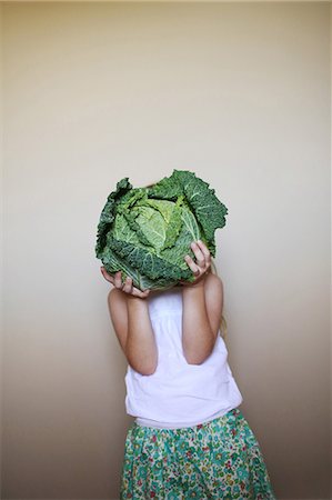 food face - Little girl playing with a cabbage Stock Photo - Rights-Managed, Code: 877-08031315