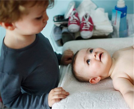 A little boy of 4 years old with his baby sister of 8 months Stock Photo - Rights-Managed, Code: 877-08031310