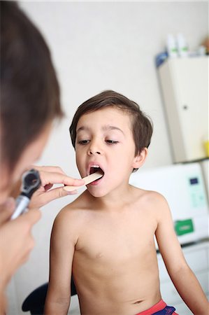 female child doctor - Young patient undergoing oral examination Stock Photo - Rights-Managed, Code: 877-08031336