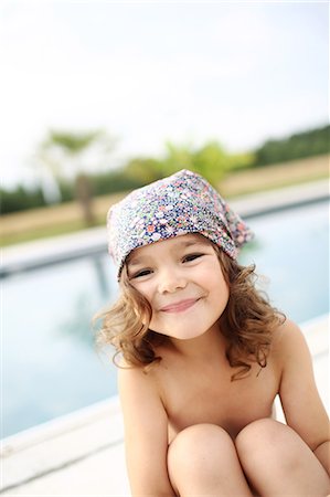 Portrait of a 4 years old girl near a pool Stock Photo - Rights-Managed, Code: 877-08031354