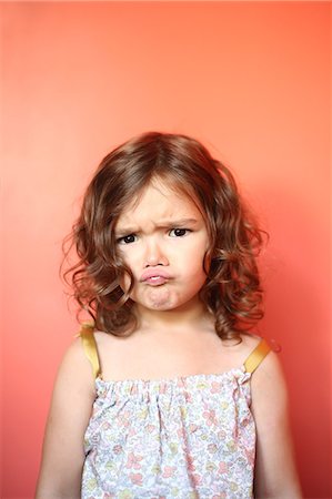 Portrait of a 4 years old girl pouting Stock Photo - Rights-Managed, Code: 877-08031351