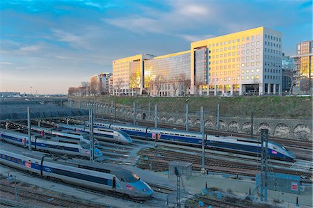 France. Paris area. Val-de-Marne. Charenton-le-Pont. Building of the bank Natixis and the ways SNCF(FRENCH NATIONAL RAILWAY COMPANY) with TGV(HST) Photographie de stock - Rights-Managed, Code: 877-08079219