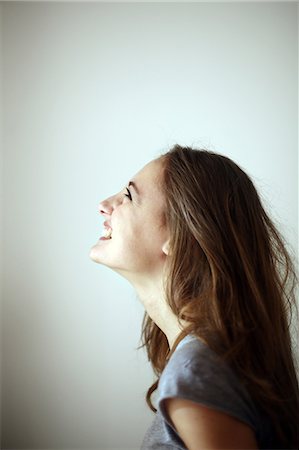 Portrait of a teenage girl smiling, the head back Stock Photo - Rights-Managed, Code: 877-08128066