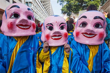 simsearch:877-08128746,k - China,Hong Kong,Annual New Years Day Festival Parade,Children Dressed in Happy Buddha Masks Stock Photo - Rights-Managed, Code: 877-08128766
