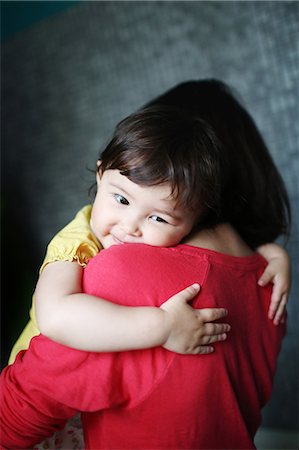 simsearch:6108-05858184,k - Little girl in her mother's arms Stock Photo - Rights-Managed, Code: 877-08128859