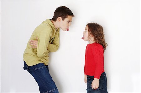 A 8 years old boy and his 4 years old sister heckling Stock Photo - Rights-Managed, Code: 877-08128980